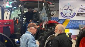 Farmers check out a new tractor at the Central Missouri Ag Club Ag Expo in Sedalia. The pandemic and changes in the agriculture business have created uncertainty in the future of farm shows