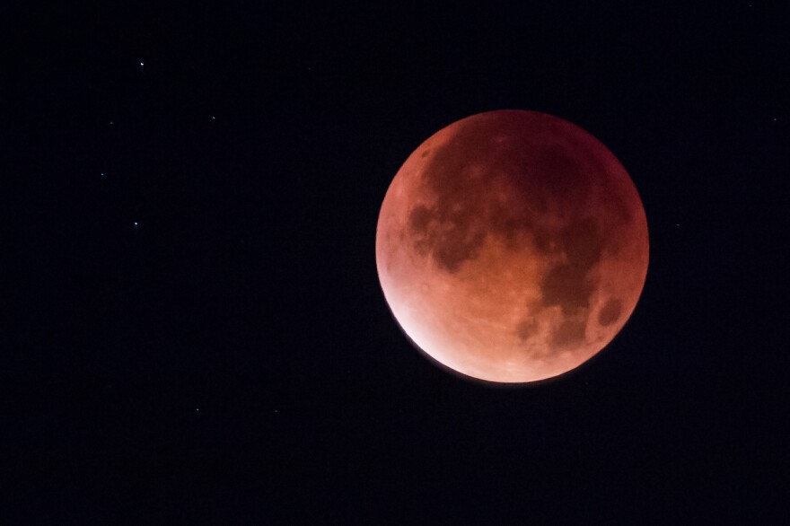 Earth's shadow obscures the view of a so-called supermoon during another total lunar eclipse — this one in Brussels in 2015.