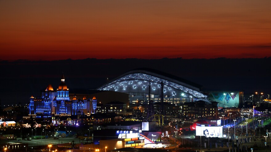 The sun sets at the Olympic Park just ahead of the Opening Ceremony of the Sochi 2014 Winter Olympics at Fisht Olympic Stadium in Russia.