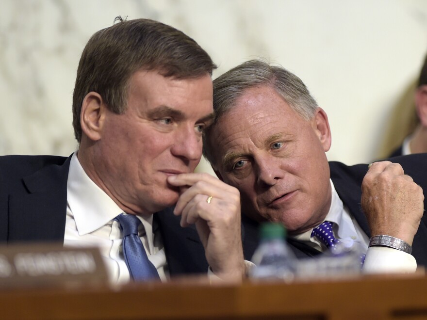 Senate Intelligence Committee Chairman Richard Burr, R-N.C. (right), and Vice Chairman Sen. Mark Warner, D-Va., confer. Their committee's hearing was closely watched and has been heavily analyzed.