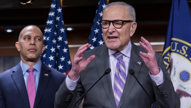 Senate Minority Leader Chuck Schumer, D-N.Y., center, speaks during a news conference as House Minority Leader Hakeem Jeffries, D-N.Y. listens, at the Capitol in Washington, Wednesday, Feb. 4, 2026.