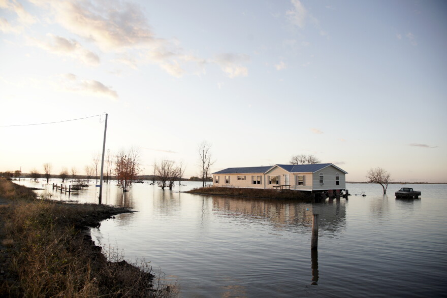 In this Oct. 22, 2019 file photo, a home is surrounded by Missouri River floodwaters in Bartlett, Iowa.