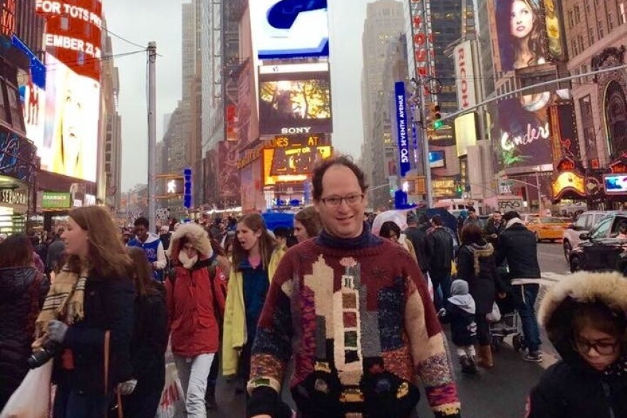 Barsky stands in New York City's Times Square wearing none other than his sweater of Times Square.