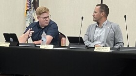 Alderpersons Brandon Moss (left) and Bobby Martin III chat before Monday's Washington City Council meeting. Each was part of a council discussion of a plan to hire a new city administrator.
