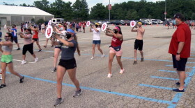 Director of the Marching Hundred Eric Smedley observes rehearsal on a late Thursday afternoon.