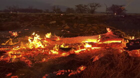 A wildfire burns in Kihei, Hawaii late Wednesday, Aug. 9, 2023. Thousands of residents raced to escape homes on Maui as blazes swept across the island, destroying parts of a centuries-old town in one of the deadliest U.S. wildfires in recent years.