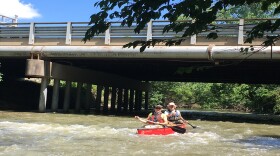 Dick Brewer (front) and Greg Bechtel canoe down the Mill Creek near Sharon Road.