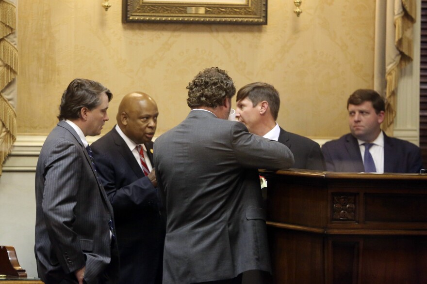 South Carolina state senators talk to cartographers that helped draw the Senate's 46 new districts on Tuesday, Dec. 7, 2021, in Columbia, S.C. The Senate approved the new maps on a 41-2 vote. (AP Photo/Jeffrey Collins)