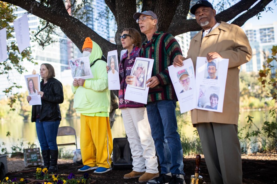 Photos of people experiencing homelessness who passed in 2021 are displayed at Auditorium Shores on Town Lake during the 29th annual memorial service held by the homelessness advocacy group House the Homeless on Sunday.