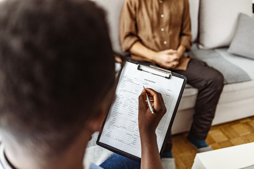 person writing on tablet 