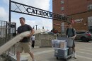 A new student and their parent push and carry items as they move into a dorm at Calhoun Hall at the University of Cincinnati. 