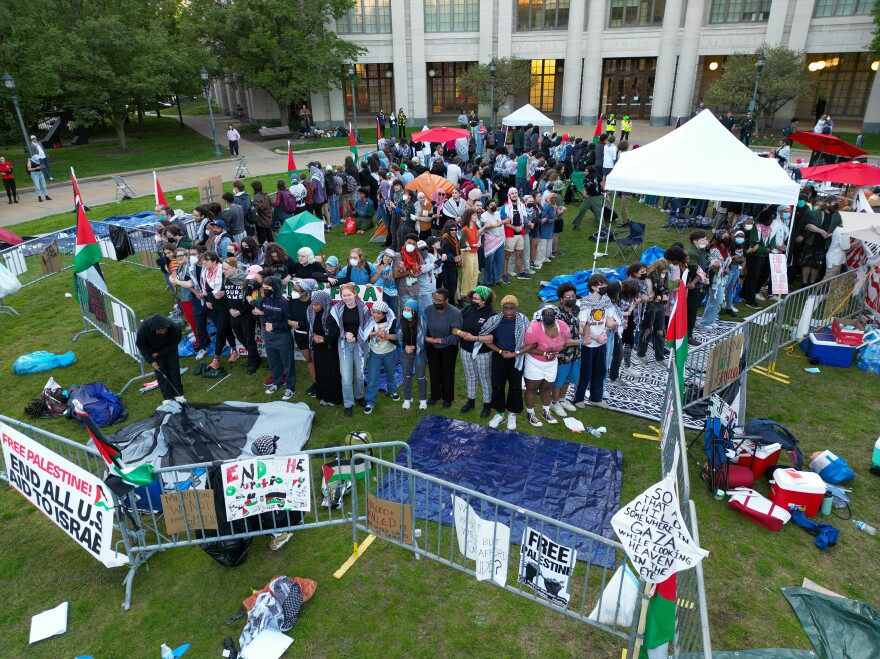 Case Western Reserve University students link arms on campus on April 30, in Cleveland.