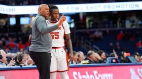 Adrian Autry speaks with Bryce Zephir (55, White) on the sideline