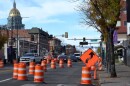 Bus Rapid Transit construction heading west from N. Washington St. along E. Colfax Ave, with crews working and traffic lane changes from Broadway downtown east to Park Ave. on November 15, 2024, in Denver, Colorado.