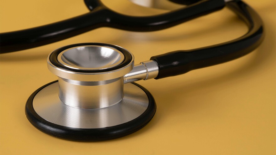 Stethoscope on a yellow background