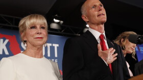 Republican Senate candidate Rick Scott speaks with his wife Ann by his side at an election watch party, Wednesday, Nov. 7, 2018, in Naples, Fla. 