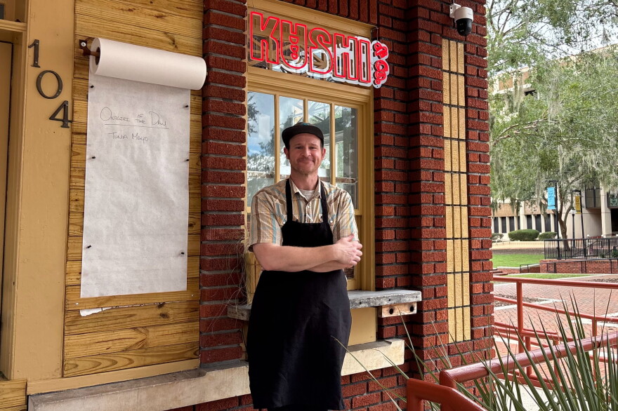 Kushi & Co. owner Charlie Keller stands outside his restaurant beside Bo Diddley Plaza. “Every day is different,” Keller said about operating the outdoor restaurant.