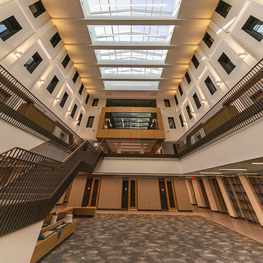 A rendering of the common area of Miami University's Bachelor Hall showing upper floors visible from the lower floor, and a skylight.