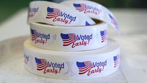 FILE - Rolls of "I Voted Early" stickers await voters in the final hours of early voting in the primary election in Noblesville, Ind., May 2, 2022. Election Day is still 12 days away. But in courtrooms across the country, efforts to sow doubt over the outcome have already begun.