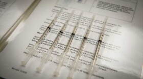 Prepared doses of COVID-19 vaccine are lined up, ready to be distributed. 