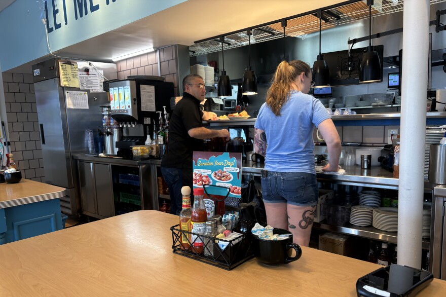 Steve McCue (left) owns Eggs Up in Norfolk and attributes the popularity of breakfast-focused restaurants like his to the consistent quality of food. McCue's daughter, Meghan (right), works as a server and said she thinks breakfast food lends itself to feeling more comforting.