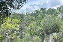 A patron rides a zip line high above the canyon. The park offers a dozen zip lines totaling 6,650 feet. Taken Tuesday, June 9, 2026.
