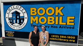 Chicopee librarians Brigitte Lyman and Beth Oliveria with the Chicoppee bookmobile at the Cabot Manor youth center.