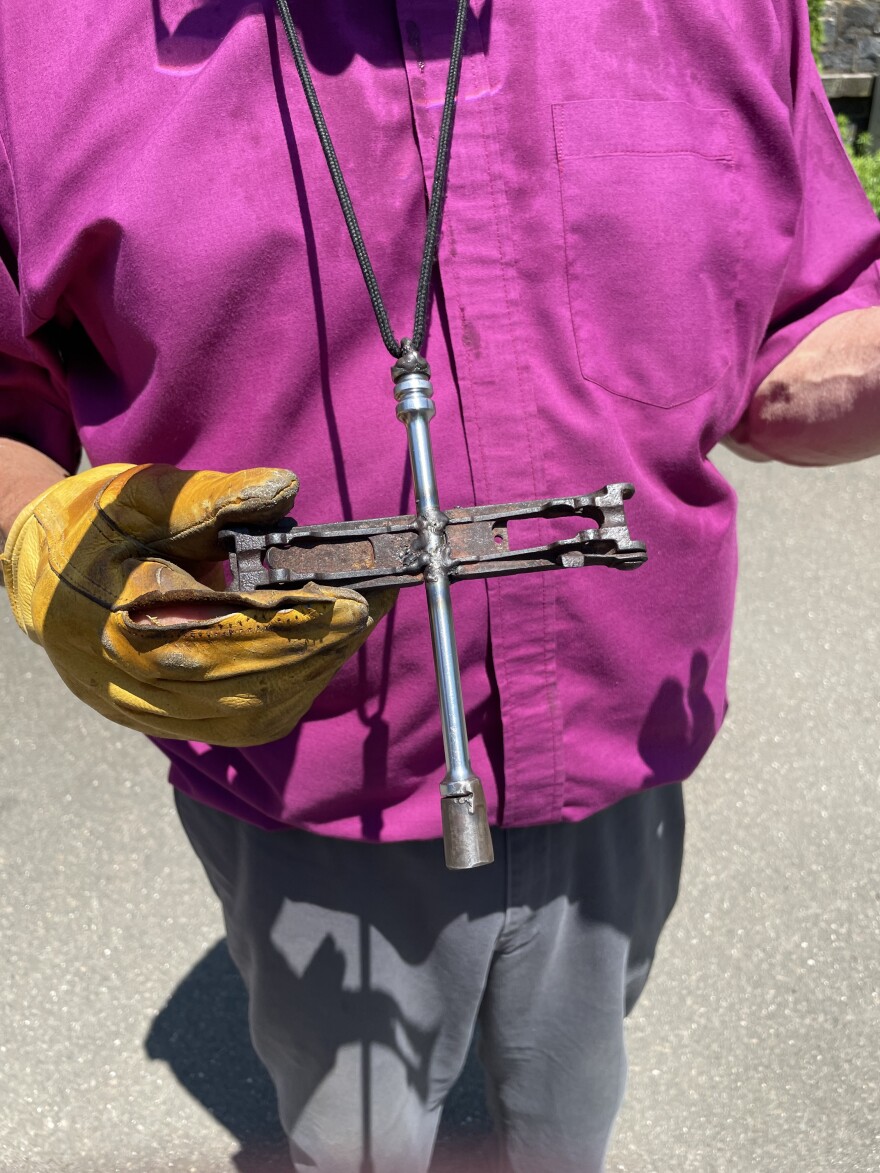 Bishop Jim Curry wears a cross made from pieces of an AK-47 from Mozambique's civil war.