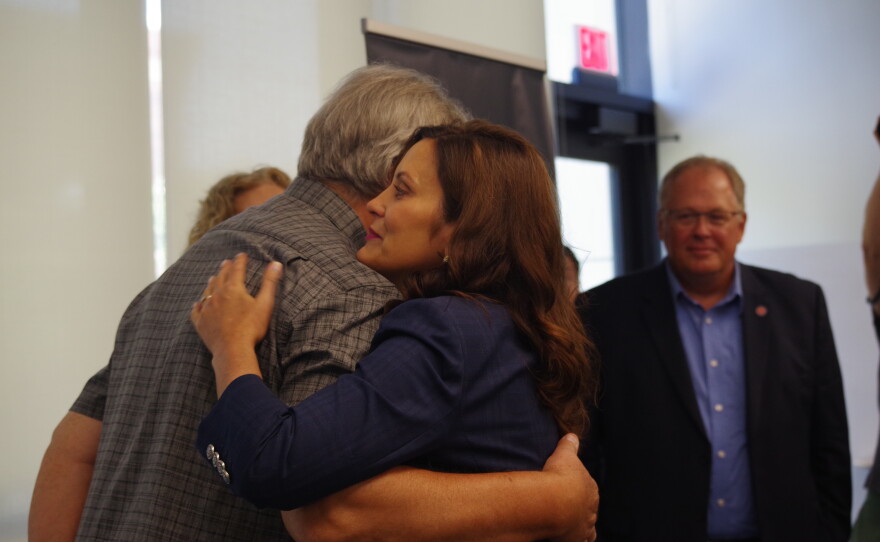 Gov. Gretchen Whitmer hugs Rick Omilian, whose daughter Maggie Wardle was shot to death by an ex-boyfriend at Kalamazoo College in 1999. Omilian and his wife Martha, advocate for victims and sensible gun laws and were part of a roundtable discussion on gun violence with Whitmer and Kalamazoo County Prosecutor, Jeff Getting.