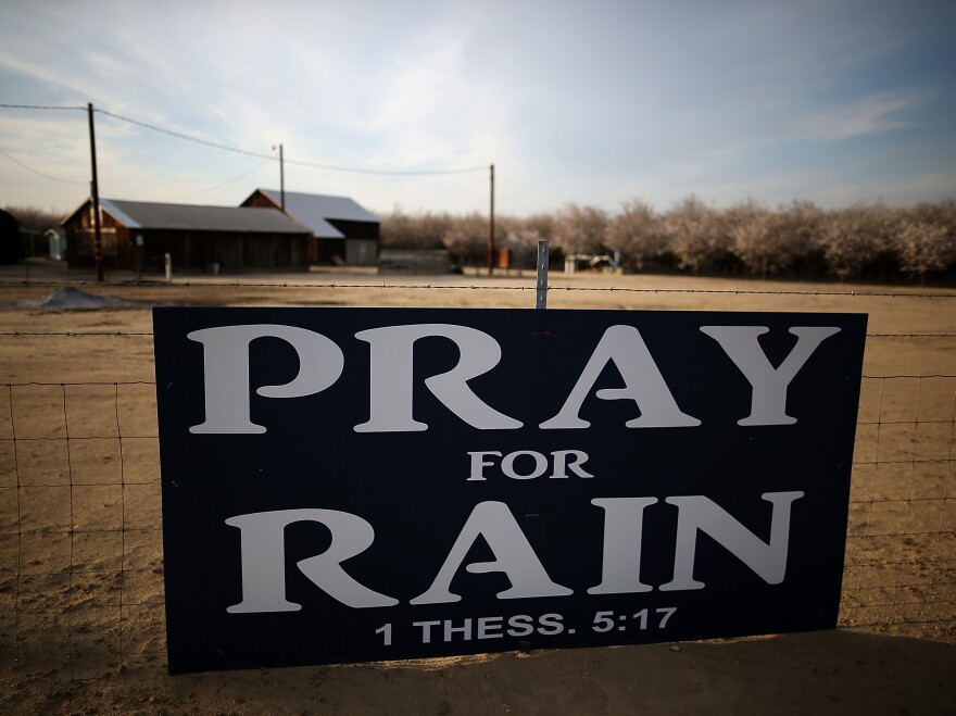 A sign posted near an almond farm in Turlock, Calif., in February. Some farmers across the West are choosing to change crops because of the drought.