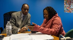 ELL Family Advocate Jean Cherry assists Silrose Cherismat, a parent of a child attending Brockton Public Schools, fill out an online job application at the Brockton Public Schools Multilingual Parent Communication Center.