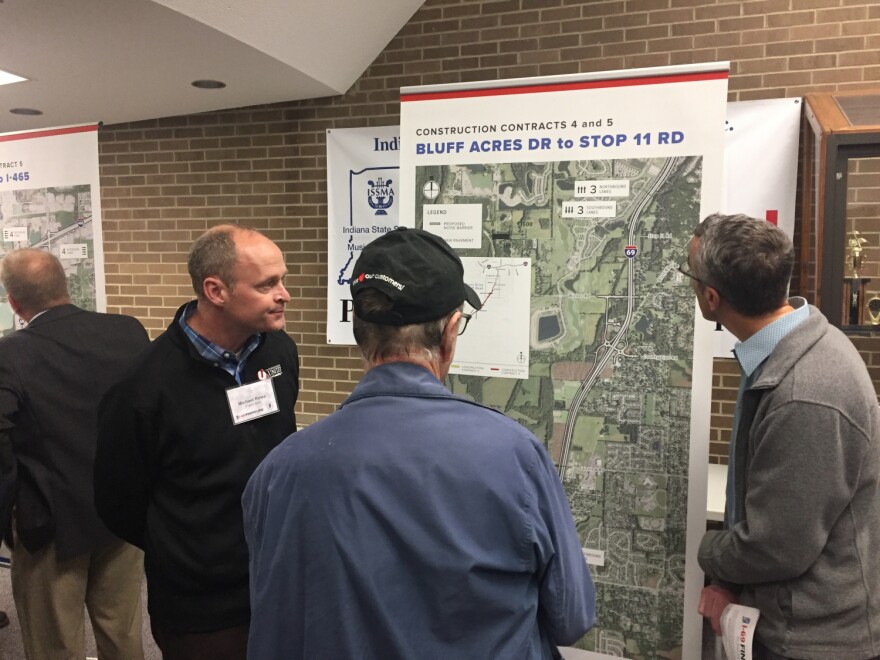 Local residents examine a map explaining changes part of the I-69 Section 6 project.