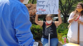 Shinnecock member Rebecca Genia confronts Southampton Town Supervisor Jay Schneiderman about delays in passing the Graves Protection Act  which would protect sacred Shinnecock burial grounds