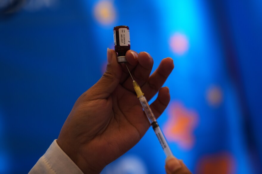 A health worker prepares a dose of the measles vaccine in Chapultepec Park in Mexico City, Sunday, Feb. 8, 2026.