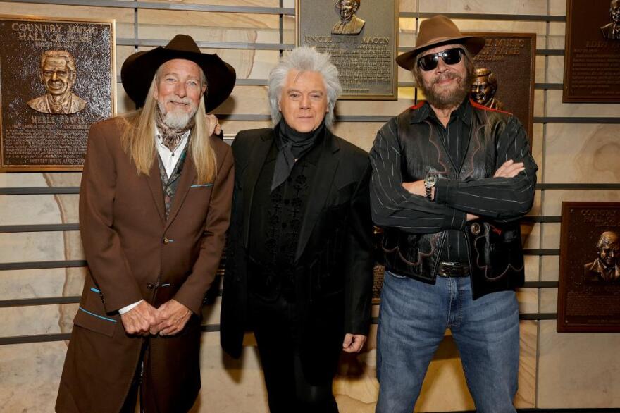 Dean Dillon, Marty Stuart and Hank Williams Jr. in the Hall of Fame Rotunda at the Country Music Hall of Fame and Museum in Nashville, Tenn., before being formally inducted as Country Music Hall of Fame members.