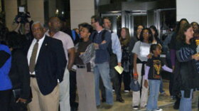 Lines to enter meeting chamber filled the Government Center lobby. align=left
