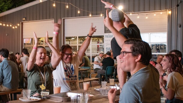 A table celebrates their win during the Game Night afterparty at Freight Bar on July 17, 2026.