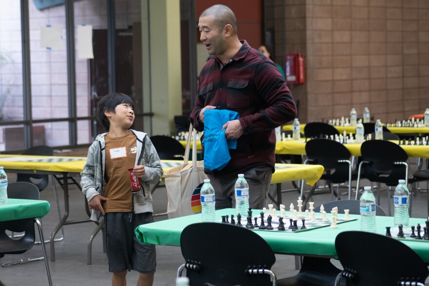 The hall of the San Francisco County Fairgrounds is organized to include non-ranked games in which players from kindergarten through 12th grade can compete. In the back tables, players can play in ranked matches.