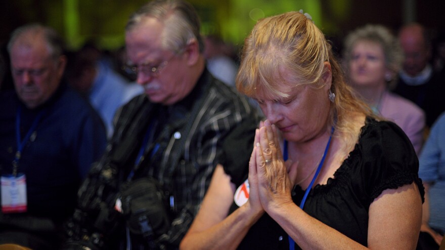Attendees pray during The Family Research Council's Values Voter Summit on Sept. 14 in Washington, D.C.