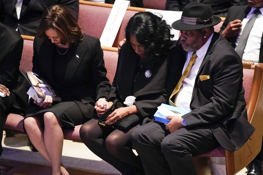 Vice President Kamala Harris, left, holds the hand of RowVaughn Wells as she is held by her husband Rodney Wells during the funeral service for her son Tyre Nichols in Memphis, Tenn., on Wednesday.