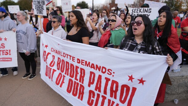 People protest against federal immigration enforcement Saturday, Nov. 15, 2025, in Charlotte, N.C.