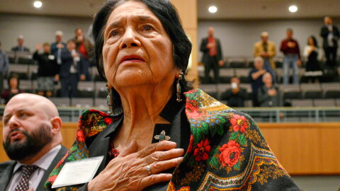 Dolores Huerta, the Mexican-American social activist who formed a farm workers union with Cesar Chavez, stands for the Pledge of Allegiance in Spanish while visiting the New Mexico Statehouse in Santa Fe. N.M., on Feb. 27, 2019.