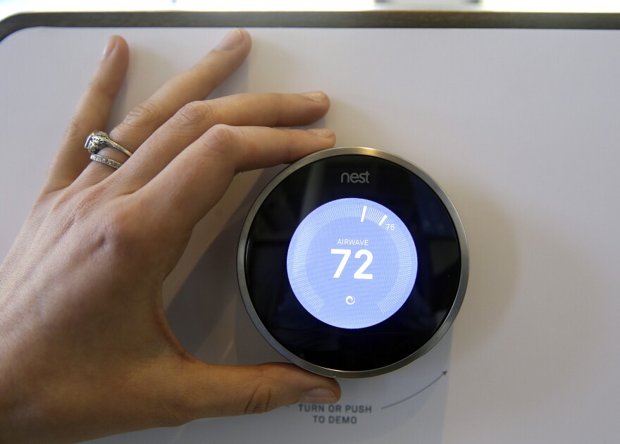 The Nest Learning Thermostat is on display following a news conference Wednesday, June 17, 2015, in San Francisco.