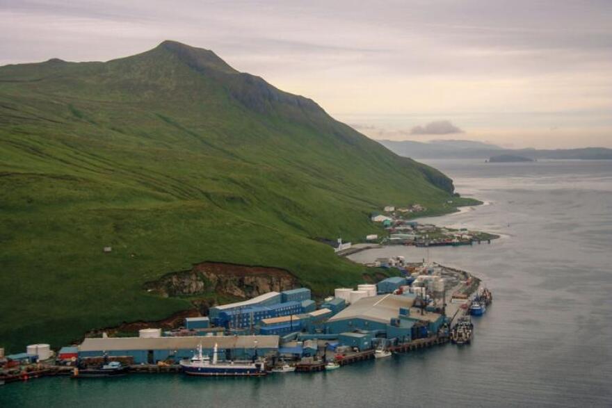 A bunch of large warehouses on the side of a mountain