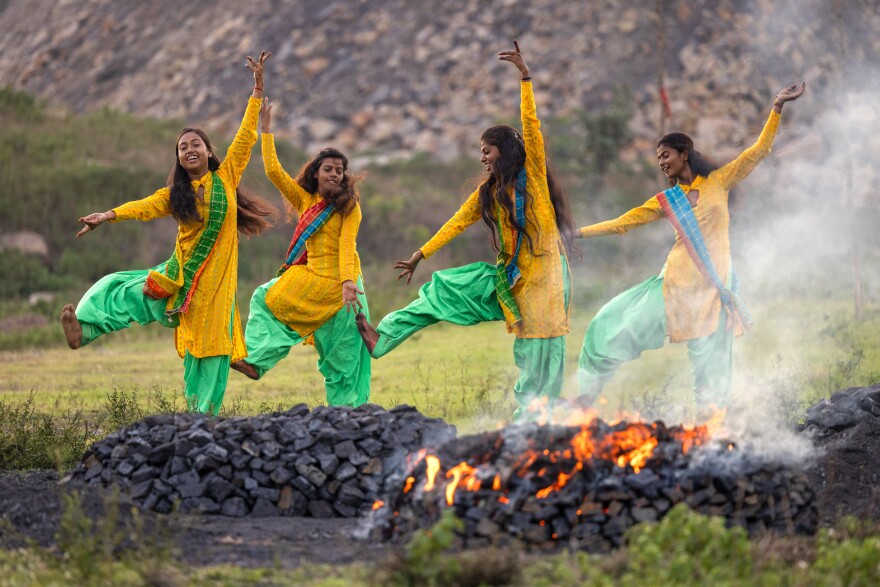 Radhika (15), Anjali (16), Suman (21), and Suhani (15) in July 2022 perform a dance routine near the village of Sahana Pahari, Jharia.