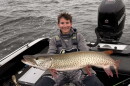 Bemidji State University graduate student Baylor Short shows a muskie caught on Leech Lake.