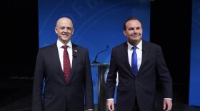 Utah Republican Sen. Mike Lee, right, and his independent challenger Evan McMullin pose for photographs before their televised debate, Monday, Oct. 17, 2022, in Orem, Utah, three weeks before Election Day. The debate will be the only time the candidates appear together in the lead-up to next month's midterm elections.