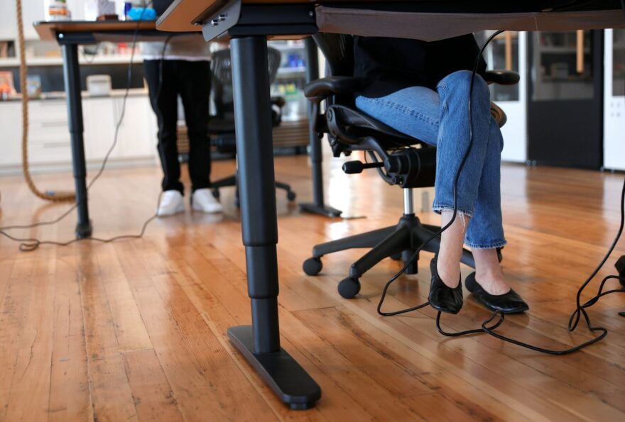 Employees at tech startup company Fast work at their desks in the office on in San Francisco, California.