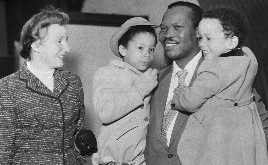 After his marriage, the real Seretse Khama spent years in exile. He's shown here in 1956 with his wife, Ruth, and two of their children.