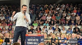 Pete Buttigieg speaks out against the Trump administration's moves so far this year Tuesday at a town hall in Cedar Rapids, Iowa organized by VoteVets, a left-leaning veterans group.